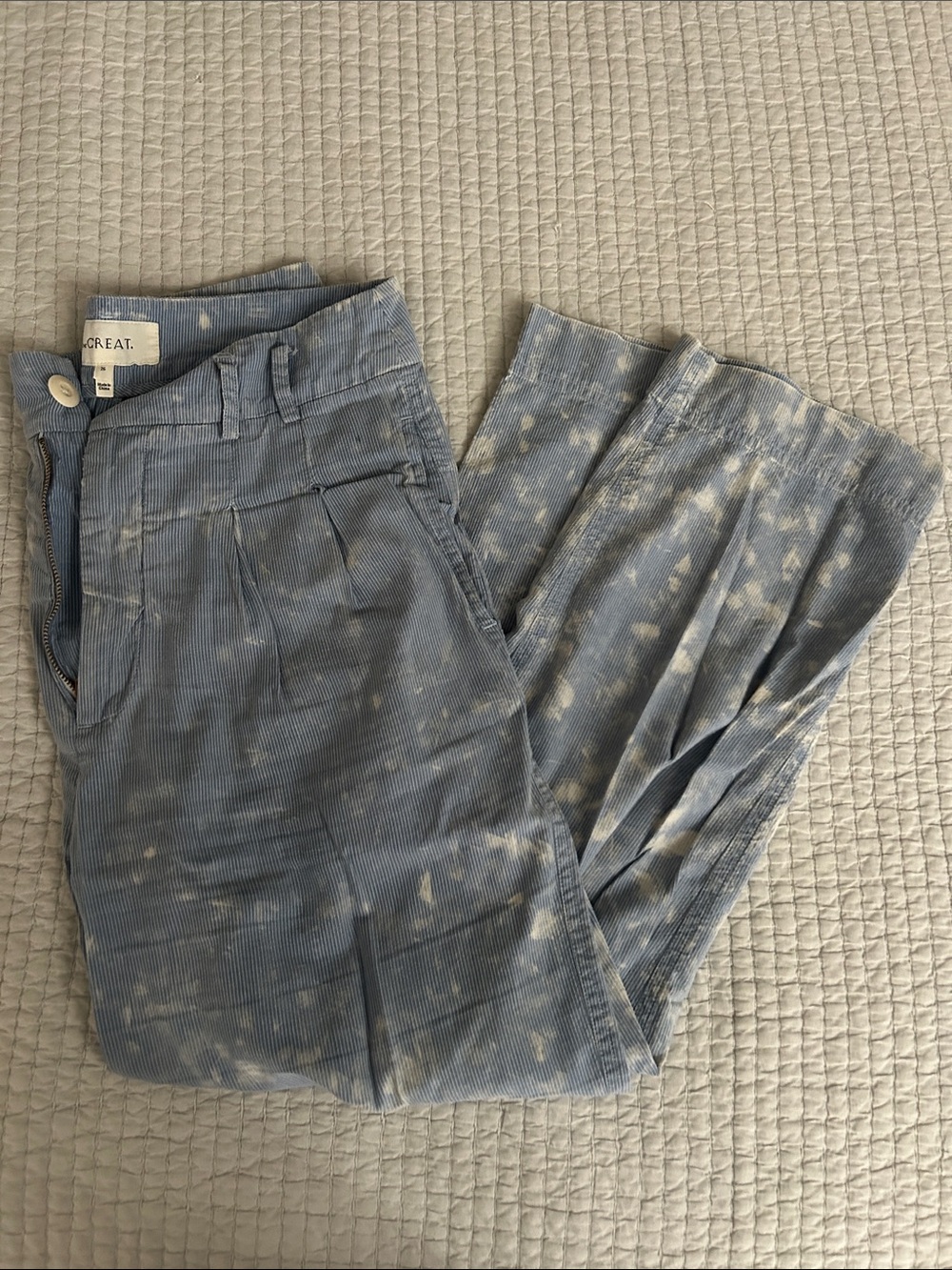 THE GREAT. Women's Ankle Cropped Corduroy Pants in Light Blue with Splatte Spots